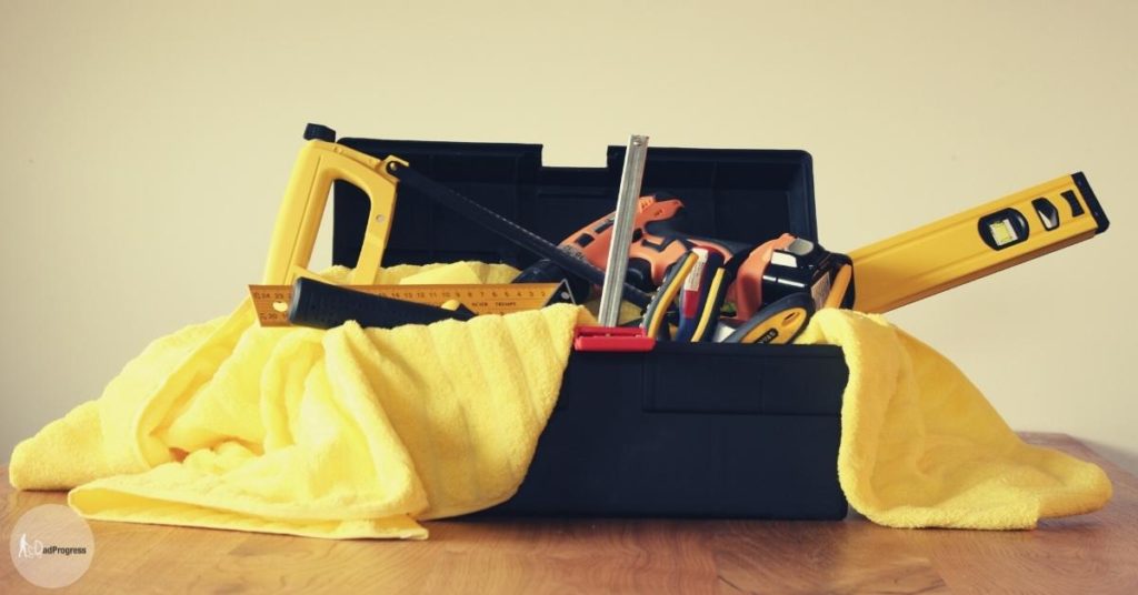 Tool (listed in the text) in a tool box on a yellow towel