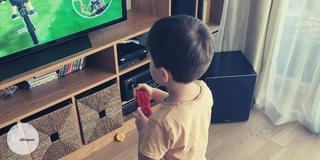 Toddler playing a Wii game